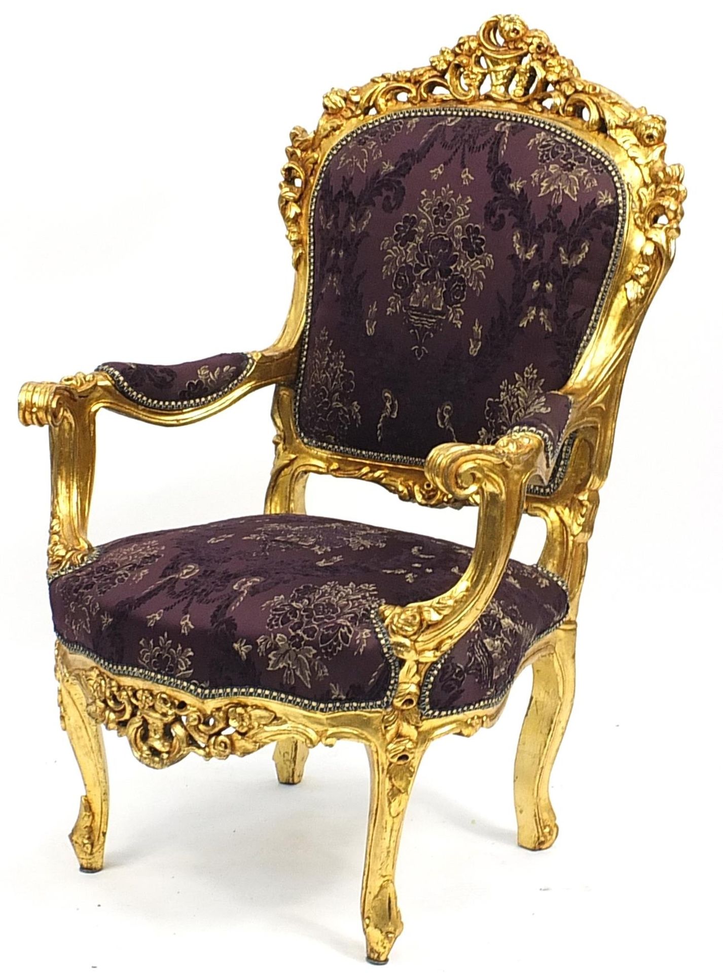 Ornate French style giltwood open armchair with purple floral upholstery, 112cm high