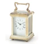 Miniature silvered carriage clock with enamelled dial and swing handle, 8cm high
