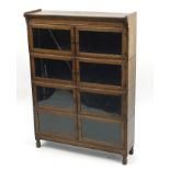 Oak four tier Globe Wernicke style bookcase, 125cm H x 89cm W x 25.5cm D