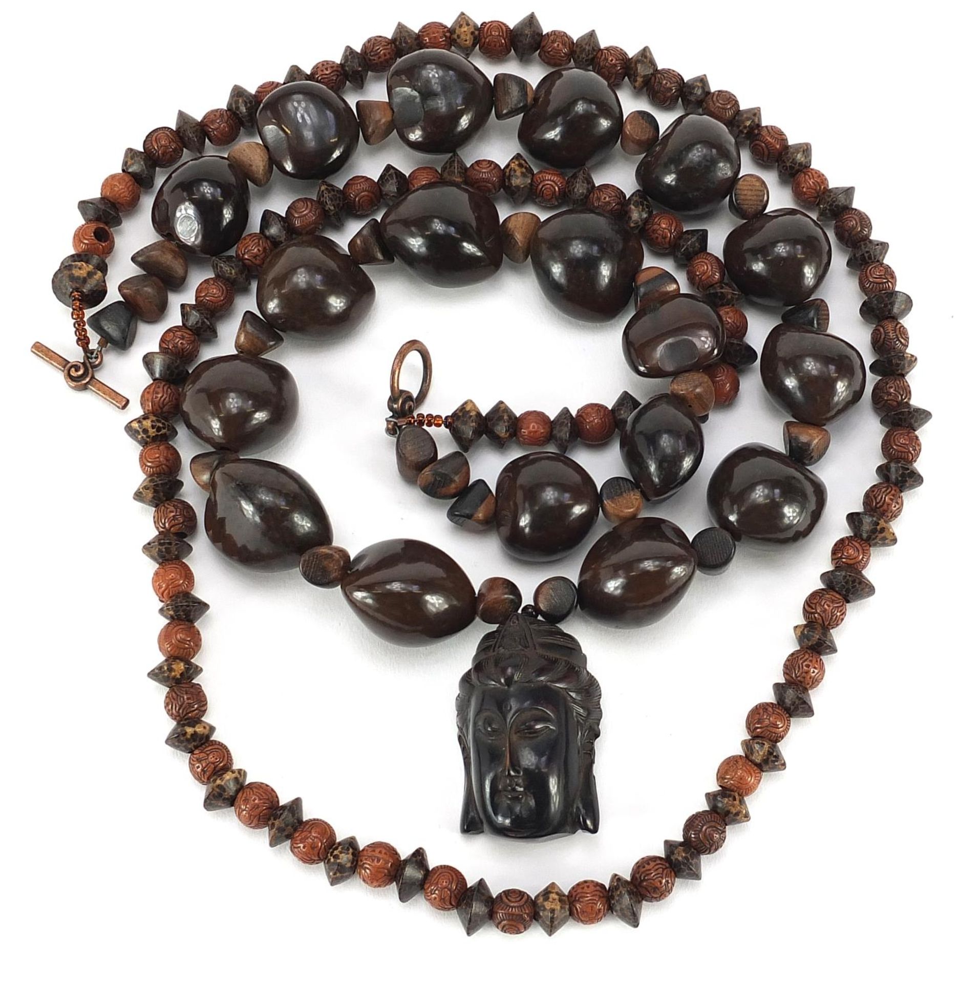 Two Asian bead necklaces including one with Chinese carved netsuke of a Buddha head - Image 2 of 4