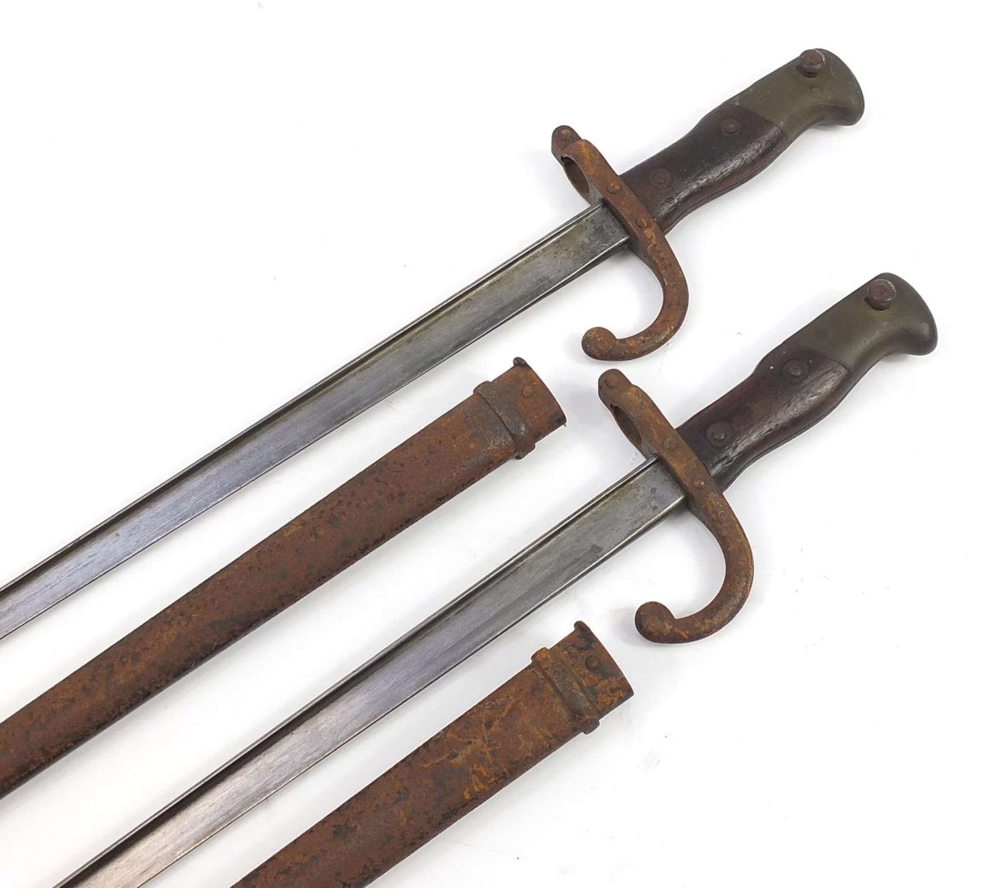 Pair of French military interest St Etienne bayonets with scabbards, each 66cm in length