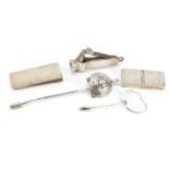 Silver objects including cigar cutter, stamp case and letter clip, the largest 10.5cm in length,