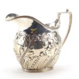 F B Thomas & Co, Victorian silver cream jug embossed with fruit and foliage, London 1891, 10cm high,