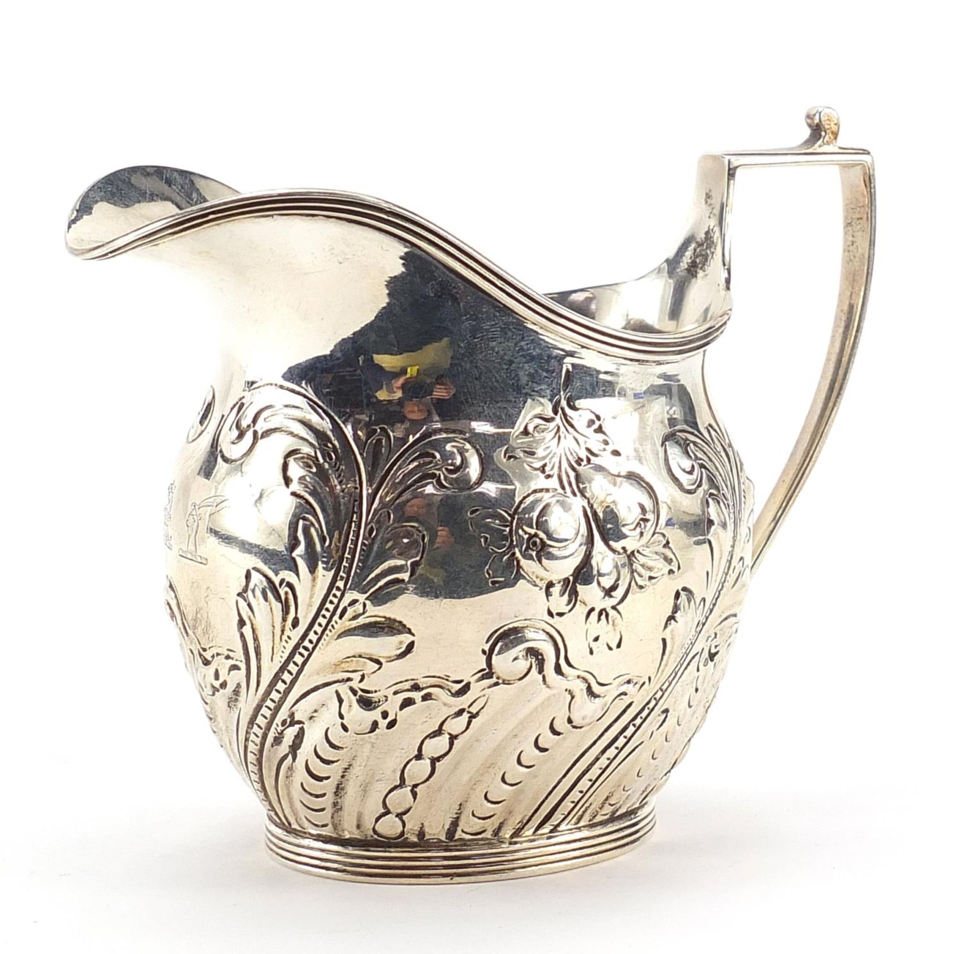 F B Thomas & Co, Victorian silver cream jug embossed with fruit and foliage, London 1891, 10cm high,