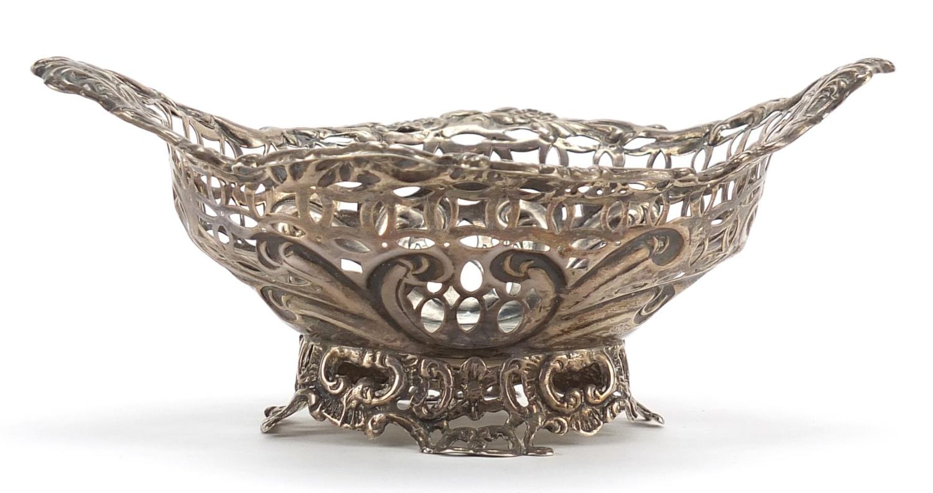 Levi & Salaman, Victorian silver bonbon dish, pierced and embossed with face masks and flowers, 16.