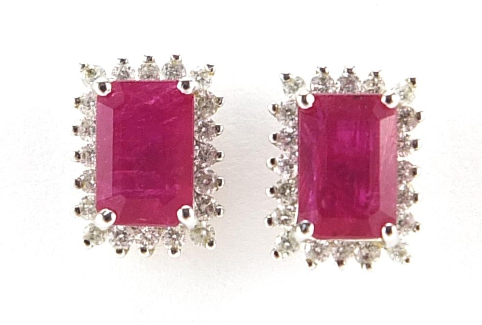 Pair of 9ct white gold ruby and diamond cluster stud earrings, 9mm high, 1.8g