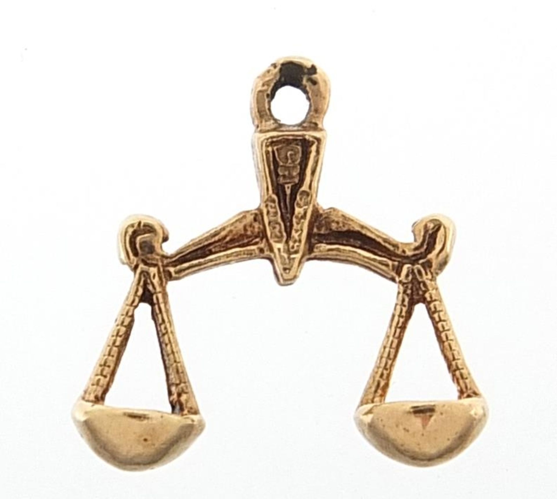 9ct gold scales charm, 1.4cm wide, 0.8g