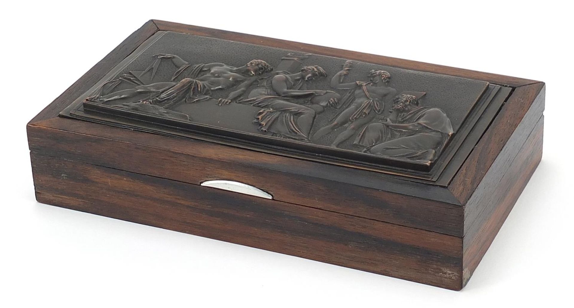 Exotic wood casket with inset bronzed plaque depicting classical figures, 4cm H x 18.5cm W x 10.