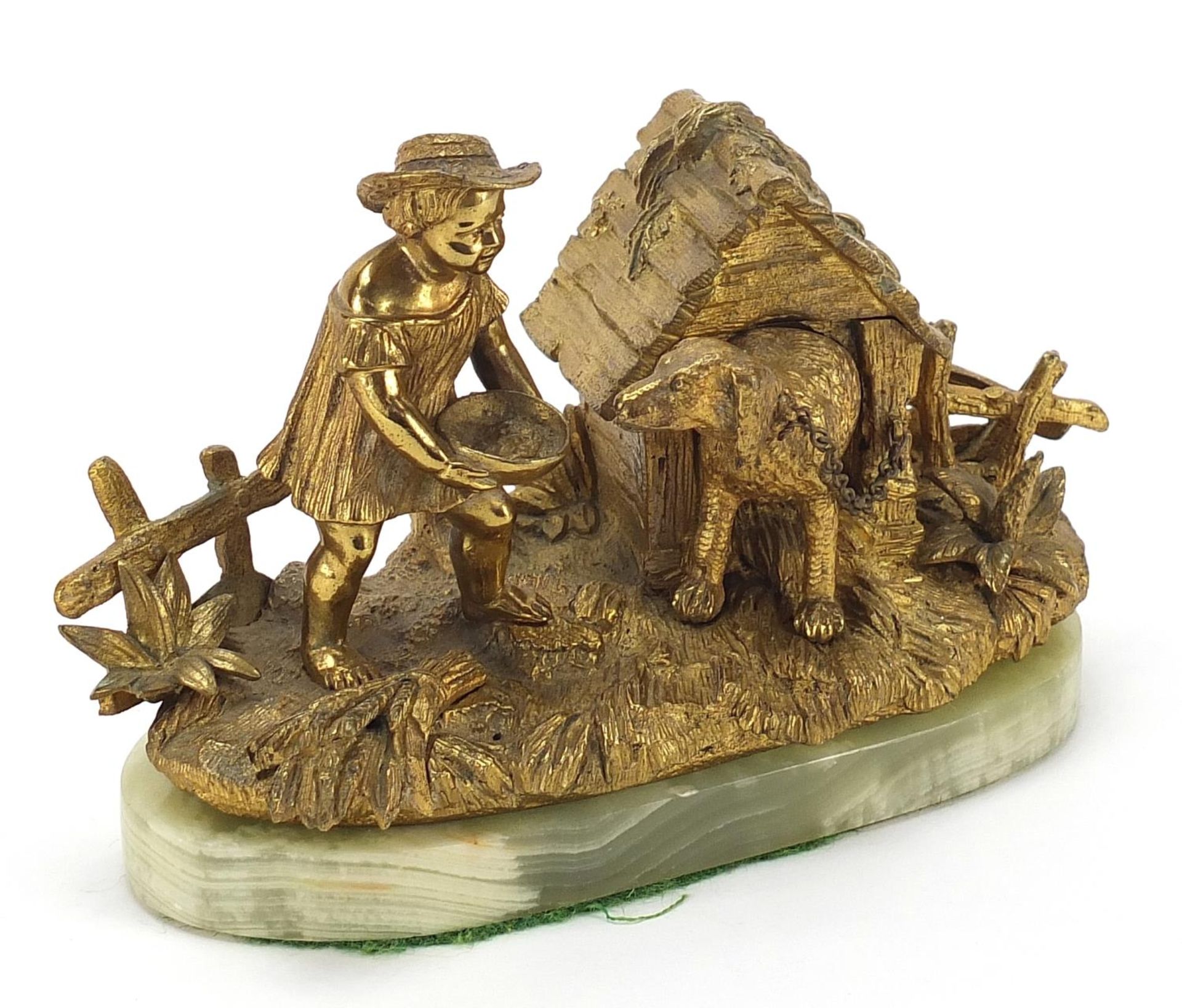19th century gilt bronze inkwell in the form of a female feeding a dog in a kennel with hinged roof,