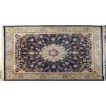 Rectangular Persian blue and cream ground carpet having an all over floral design, 360cm x 260cm