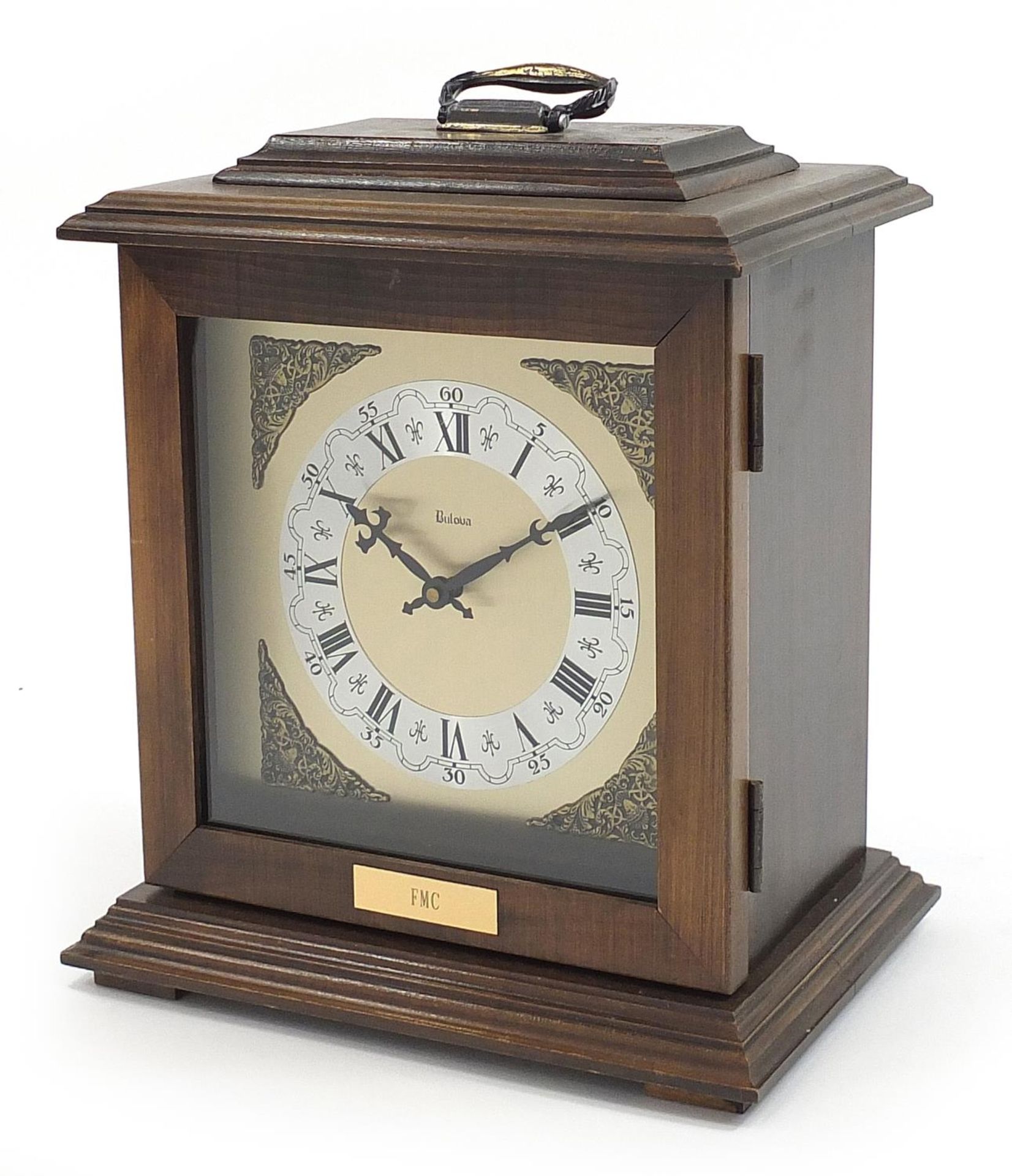 Mahogany case Bulova bracket clock with Roman and Arabic numerals, 34cm high