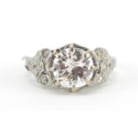 Platinum diamond ring with ornate shoulders, the central diamond approximately 1.8 carat, size I,