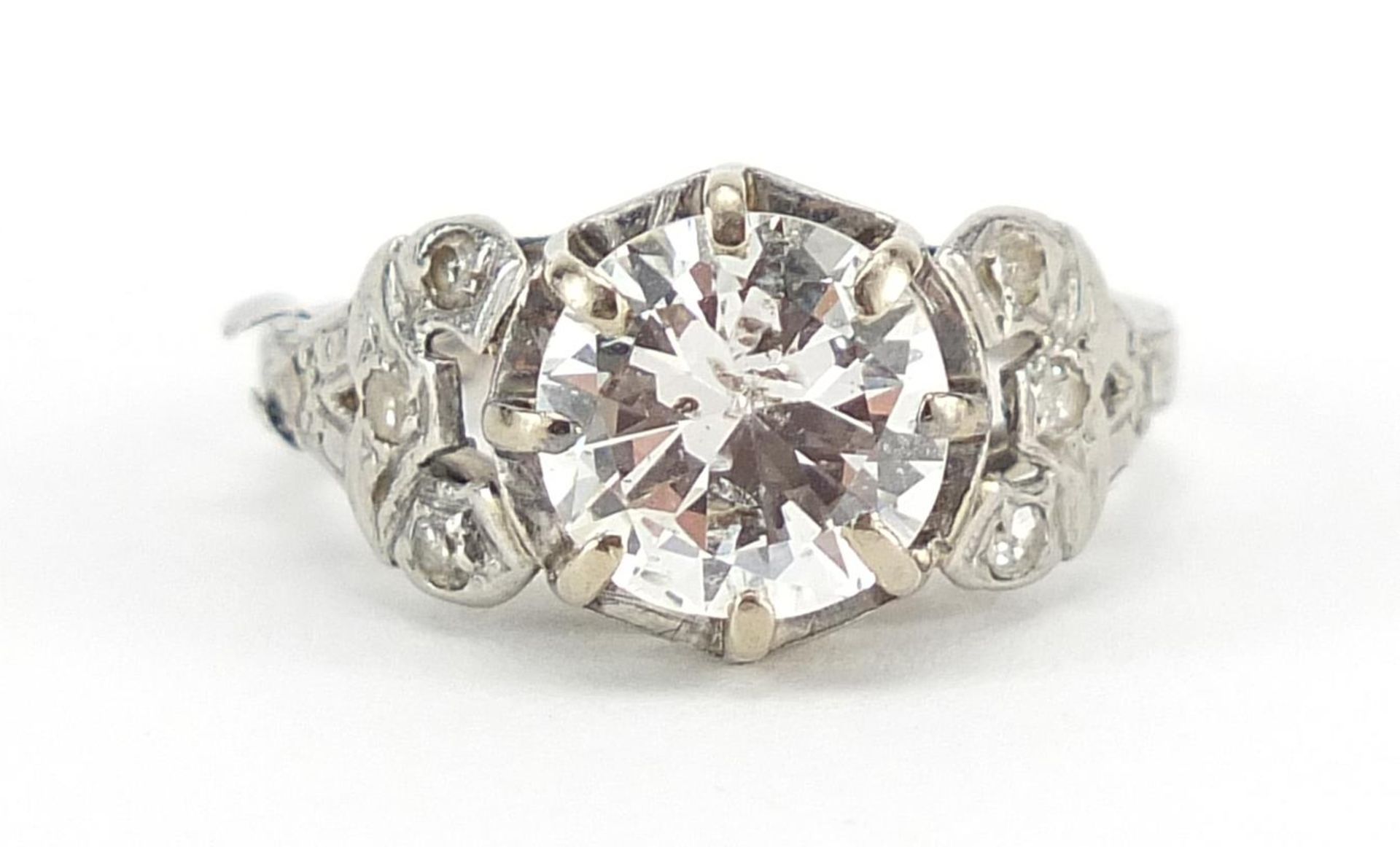 Platinum diamond ring with ornate shoulders, the central diamond approximately 1.8 carat, size I,