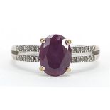 9ct white gold colour changing created Alexandrite ring with diamond set shoulders, stamped 0.10 to