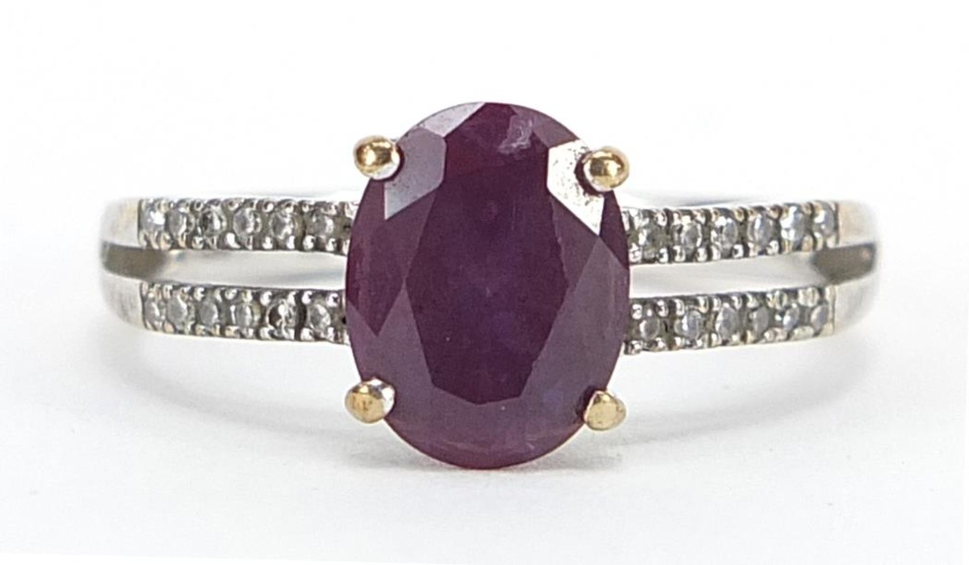 9ct white gold colour changing created Alexandrite ring with diamond set shoulders, stamped 0.10 to