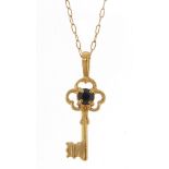 Unmarked gold sapphire key pendant, (tests as 9ct gold) on a 9ct gold necklace, 2cm high and 40cm in