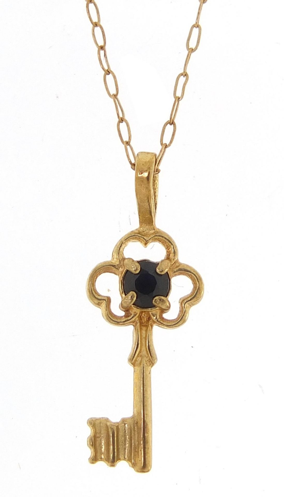 Unmarked gold sapphire key pendant, (tests as 9ct gold) on a 9ct gold necklace, 2cm high and 40cm in