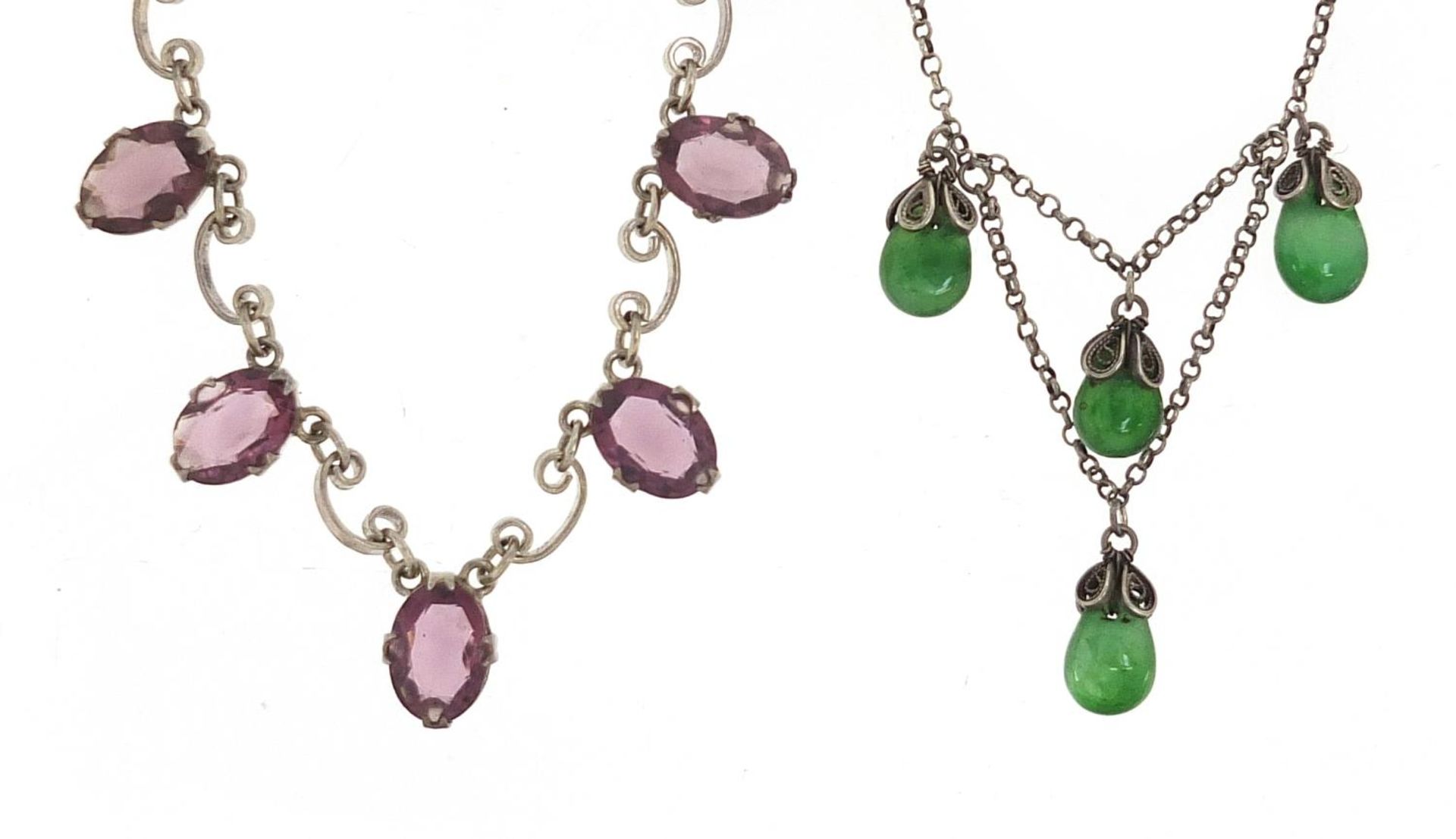 Two Sterling silver necklaces set with purple and green stones, 42cm and 40cm in length, 17.4g