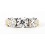 18ct gold diamond three stone ring, the central diamond weighing 0.96ct flanked by two diamonds each