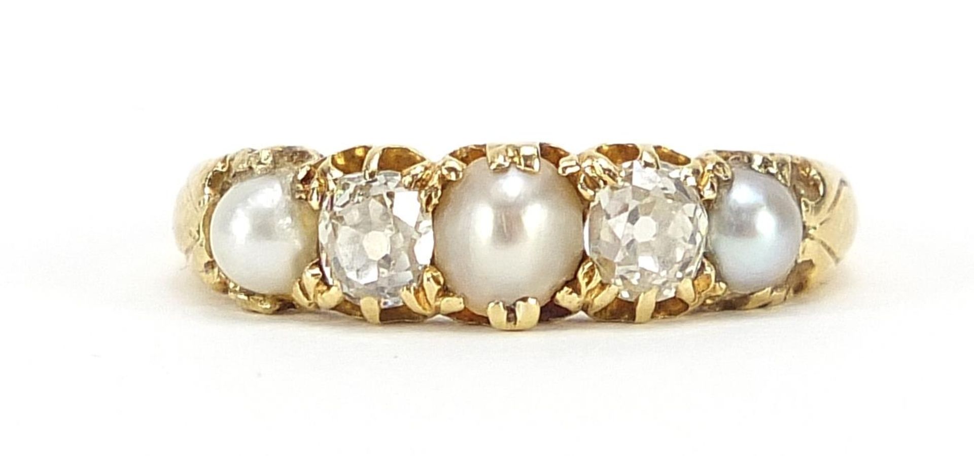 Unmarked gold diamond and pearl five stone ring, size P/Q, 3.4g