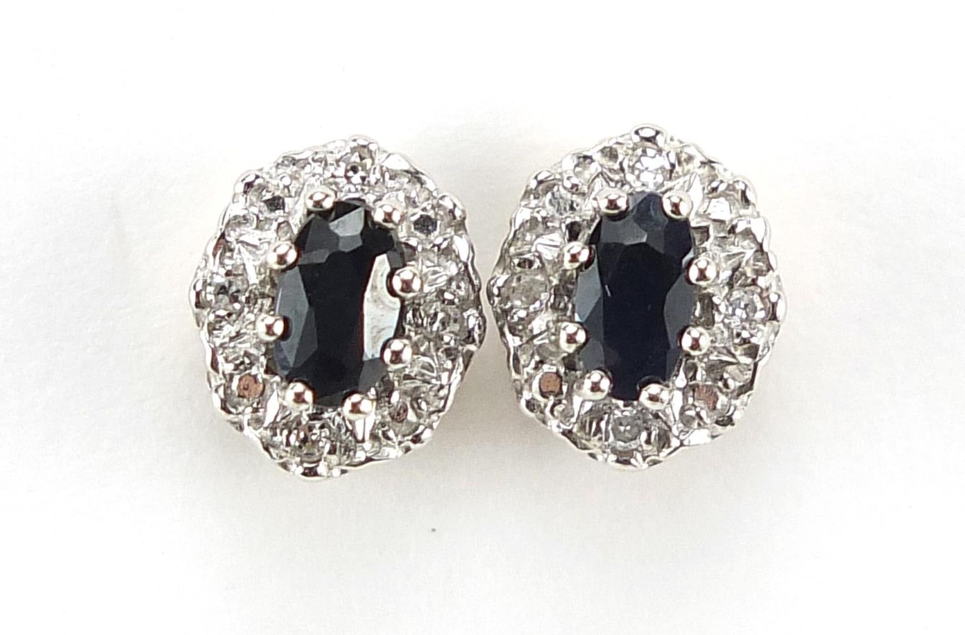 Pair of 9ct gold sapphire and diamond cluster stud earrings, 8mm high, 1.9g