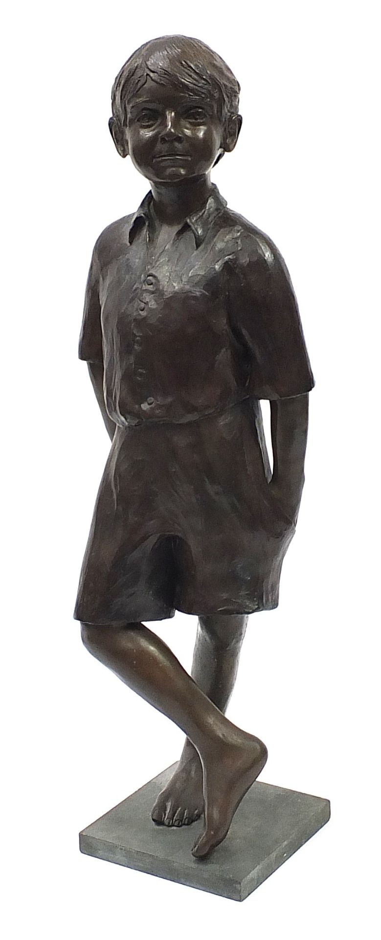 Judith Holmes Drewry, life size patinated bronze study of a young boy holding a ball, signed to