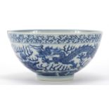 Chinese blue and white porcelain bowl hand painted with a dragon chasing a flaming pearl amongst