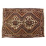 Middle Eastern brown ground rug having an all over geometric floral design, 220cm x 170cm