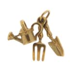 9ct gold watering can, trowel and fork charm, 1.5cm high, 1.3g