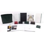 Four vintage and later watch boxes and a selection of Rolex brochures to include Omega and Longines,