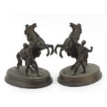 Pair of spelter Marley horse with trainer figures, 21.5cm high