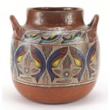 South American pottery vase with twin handles hand painted with stylised fish, 25cm high