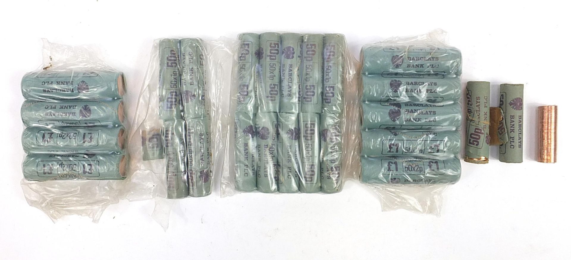Collection of two pence pieces housed in sealed tubes