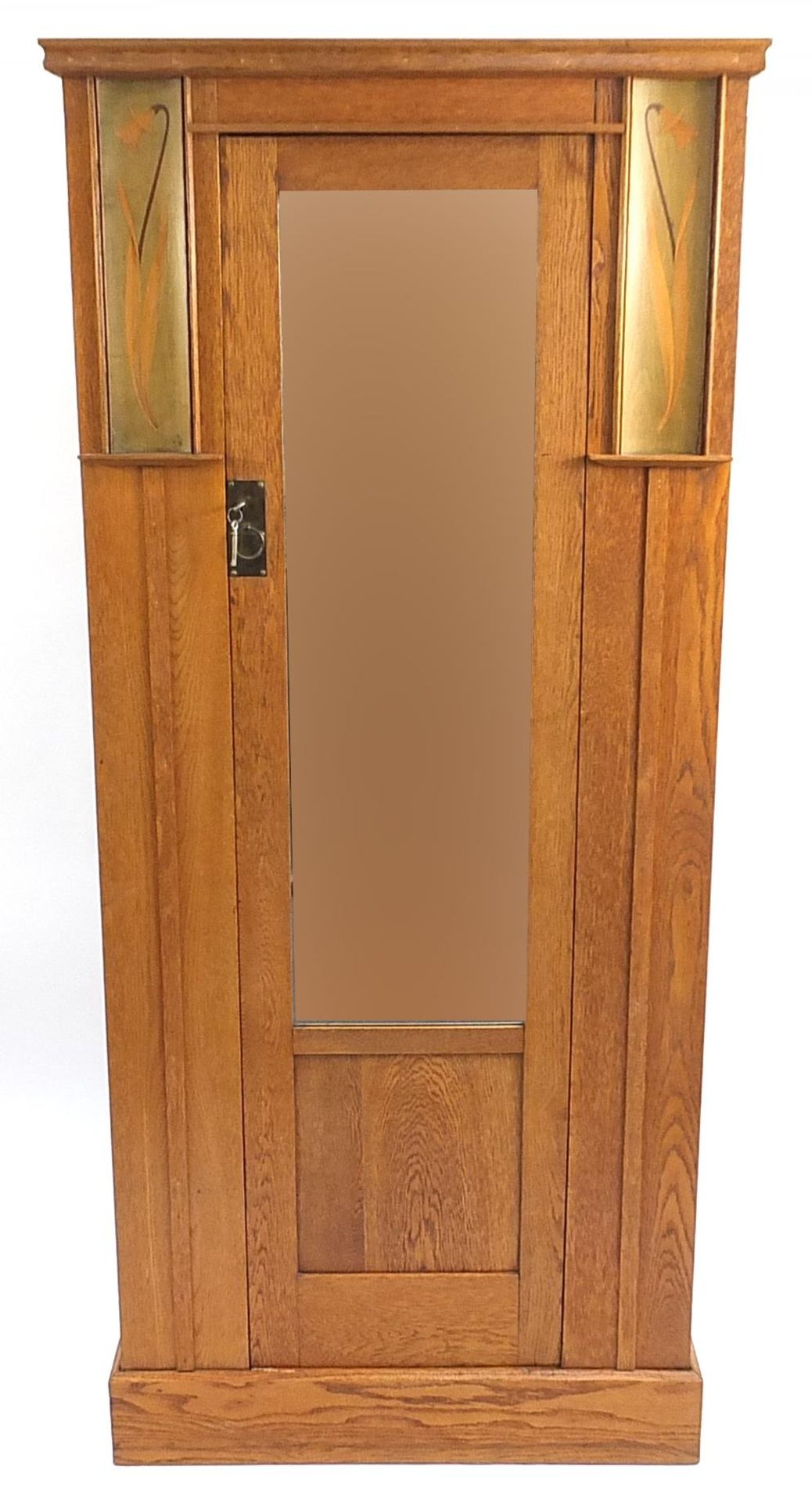 Manner of Baillie Scott, Liberty & Co Arts & Crafts oak wardrobe with mirrored door inlaid with daf