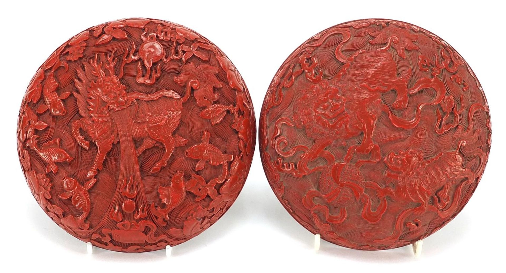 Chinese cinnabar lacquered bun box and cover carved with Foo dogs amongst clouds, 18cm in diameter - Image 3 of 3