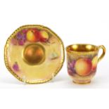 Royal Worcester porcelain cup and saucer hand painted with fruit by A Kendry, the largest 11.5cm