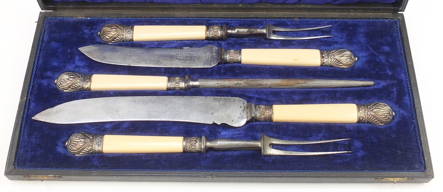 Five piece carving set with ivorine handles housed in a velvet and silk lined fitted case, the blade - Image 2 of 4