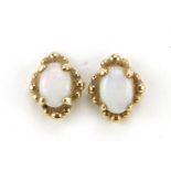 Pair of 9ct gold cabochon opal stud earrings, 1.1cm high, 1.7g