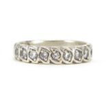 Unmarked white metal diamond half eternity ring, size N, 3.9g