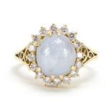 18ct gold cabochon star sapphire and diamond ring with pierced shoulders, size O, 8.3g