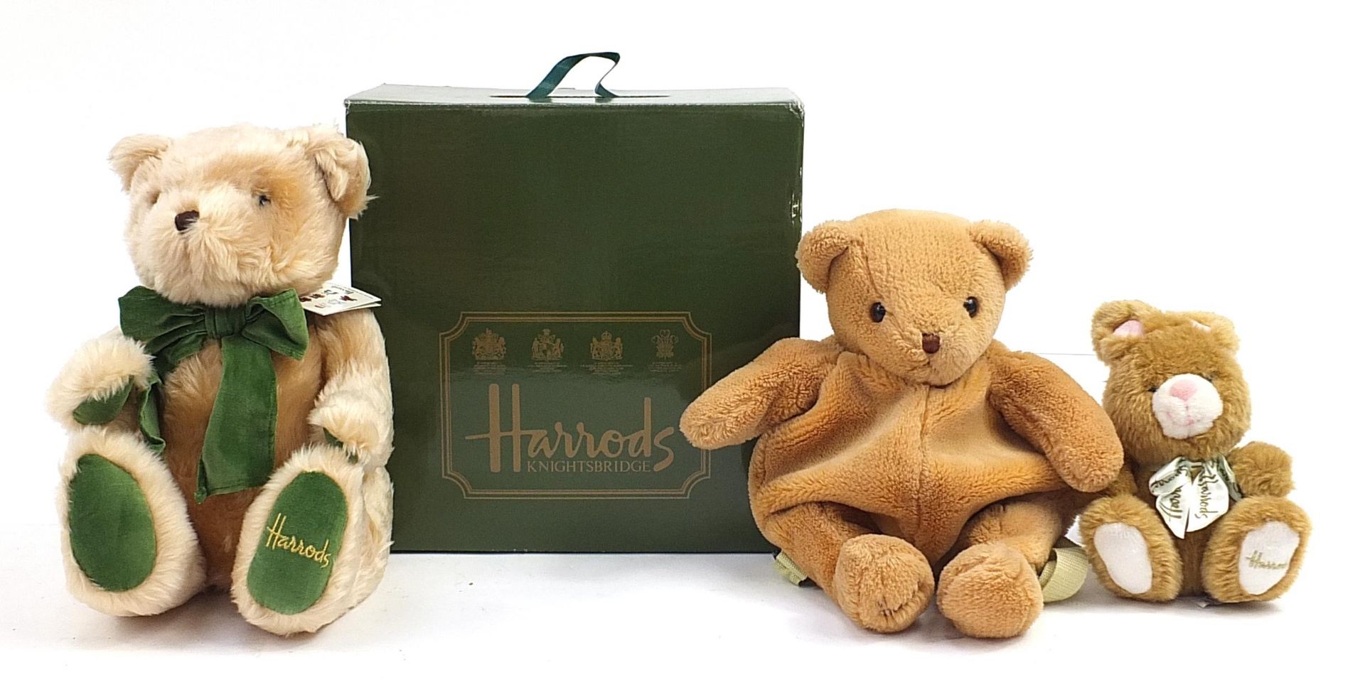 Two Harrods teddy bears and a Harrods bear bag, one with box