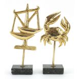 Fondica, two French Brutalist gilt brass zodiac sign sculptures raised on rectangular marble