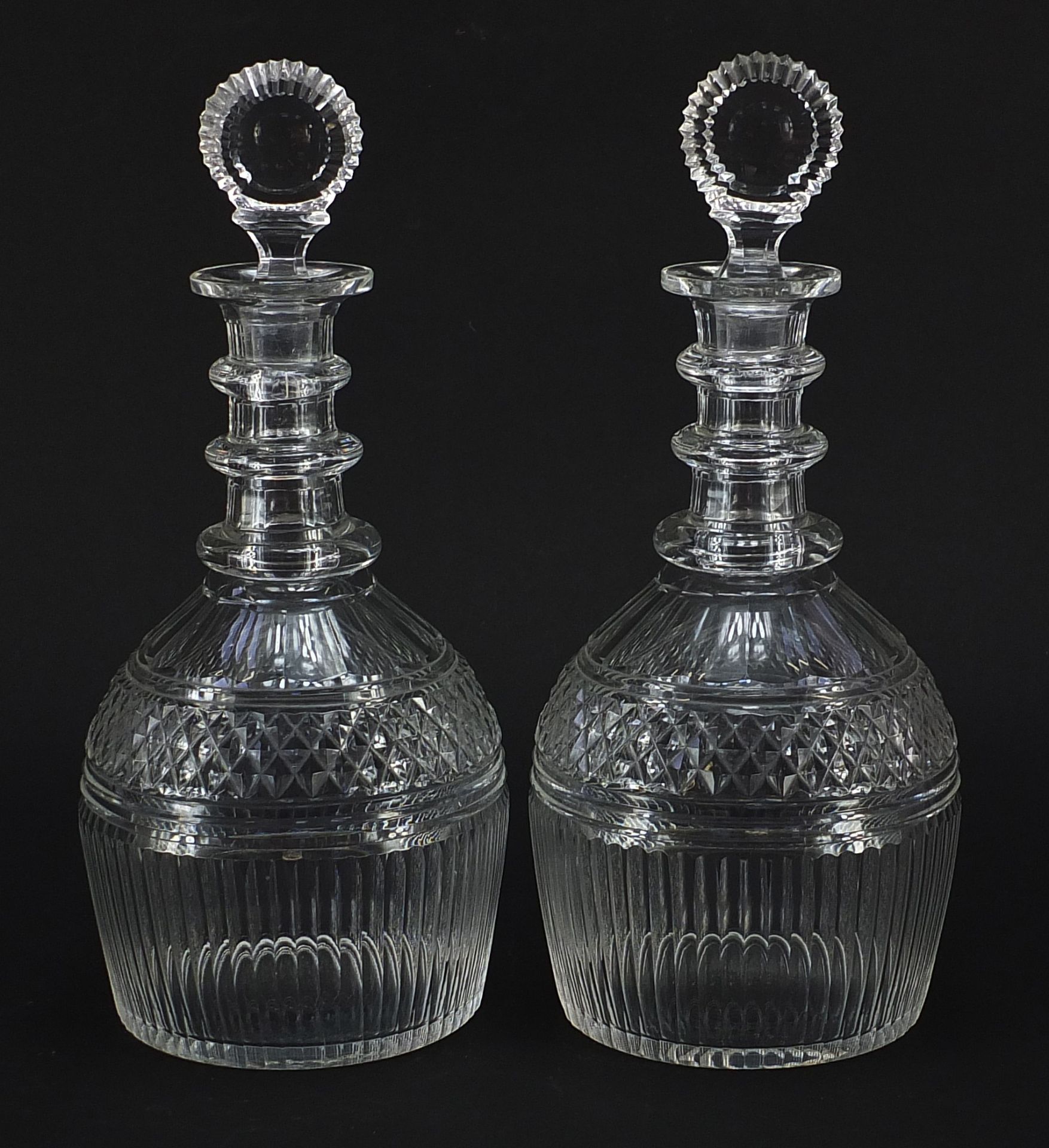 Pair of 18th century cut glass Prussian shape decanters with three rings with stoppers, each 28cm
