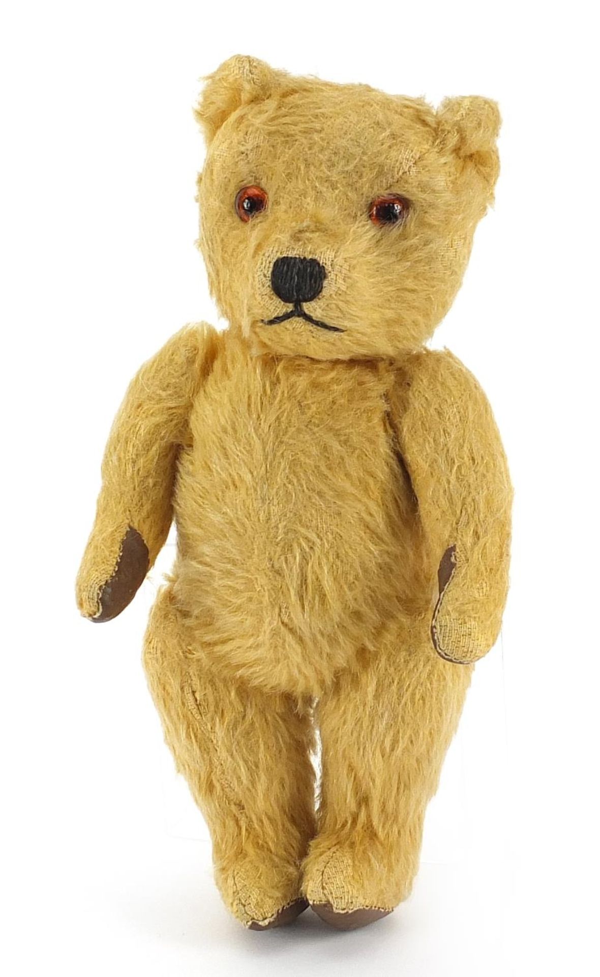 Vintage golden straw filled teddy bear with jointed limbs, 23.5cm high