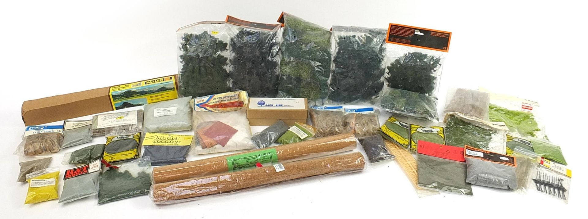 Model railway landscape accessories in packets including grass, trees, sand and cork