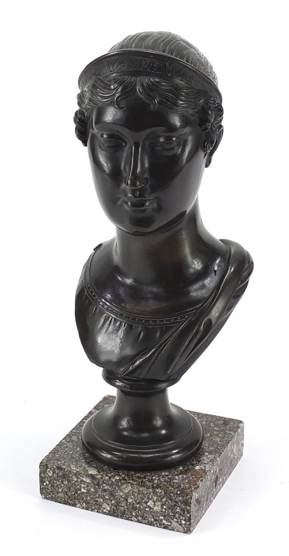 Antique classical patinated bronze bust of a Grecian female raised on a square marble base, 29cm