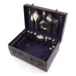 Edwardian purple leather travelling vanity case with silver mounted items including brushes,