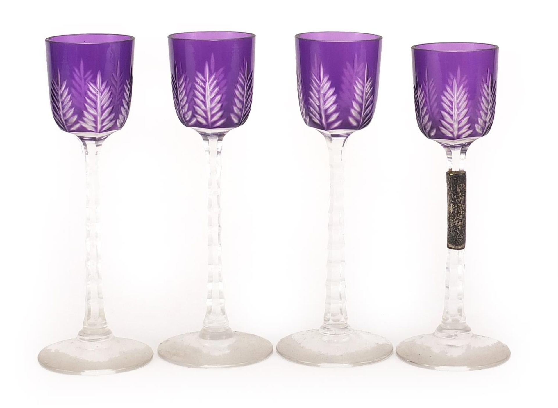 Four Bohemian purple flashed cut glass liqueur glasses, each 14cm high