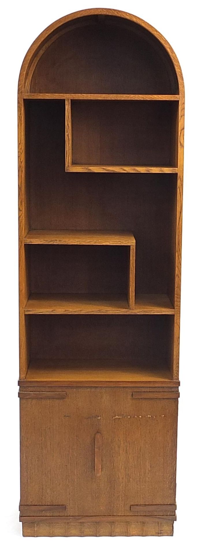 Manner of Heals, Art Deco oak dome topped open bookcase with cupboard base, 168cm H x 50.5cm W x