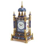 Champleve enamel and brass mantle clock with circular dial having Roman and Arabic numerals, 33cm